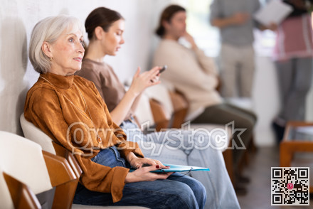 People are sitting in line and waiting for an interview