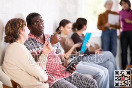 man in the waiting list for an interview in the office