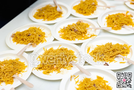 Portions of traditional dish Valencian cuisine Fideua de Marisco