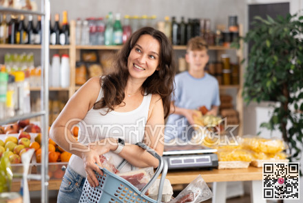 Adult woman with son choosing groceries in store