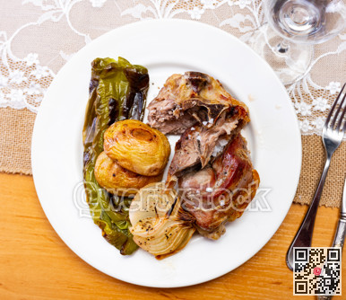 Fried fatty and juicy lamb and vegetable side dish of potato and bell pepper