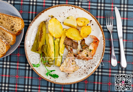 Appetizing rabbit with potatoes and vegetables