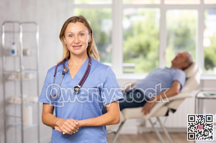 Confident professional female doctor standing in medical office