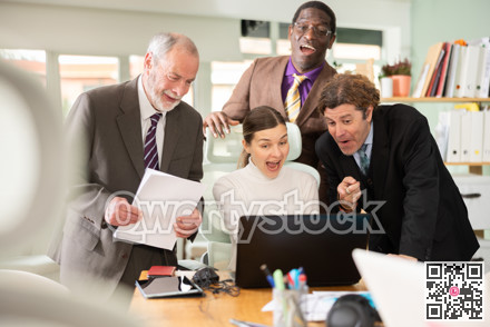 Team of businessmen laugh at funny video posted online during coffee break