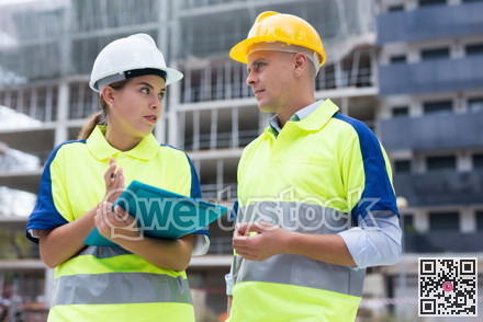 Civil engineers checking work process in construction site