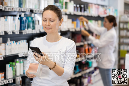 Adult woman looking for cosmetic product from photo on internet