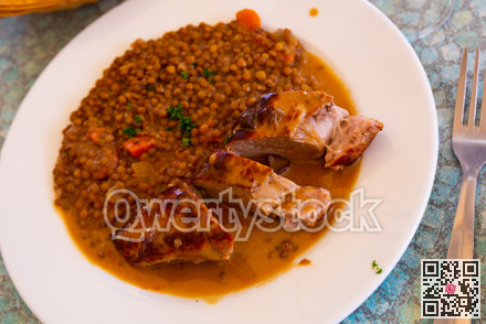Delicious pork tenderloin with mousserons sauce and lentils