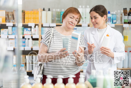 woman consults with a pharmacist before buying a cream