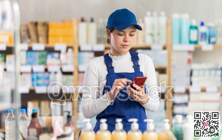 Young woman worker with phone choosing medicines and hygiene products