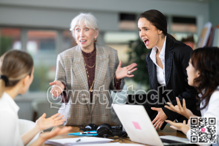 Group of female employees in office are shouting at each other