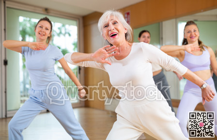 Dynamic elderly woman dancing hip-hop