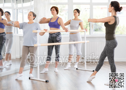 Adult woman teacher showing ballet movements