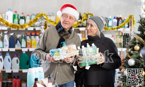 Elderly couple choosing a gift set for Christmas