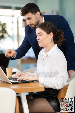 Employees working on the project in office