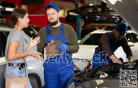 Mechanic guy signs agreement with young woman client