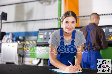 Portrait of foreman girl with folder of documents in glass workshop