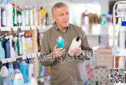 Elderly man choosing a shower gel and shampoo