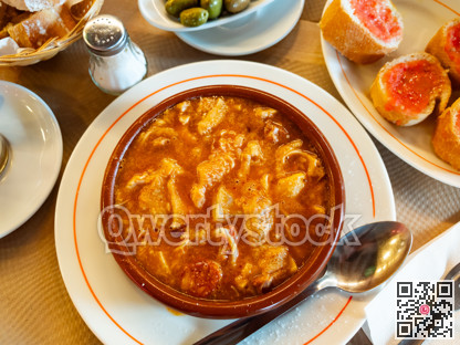 Portion of stewed tripe is cooked in plate - stomach of cattle