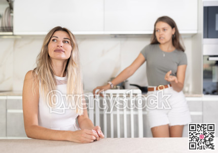 Adult girl shouting at stressed mother