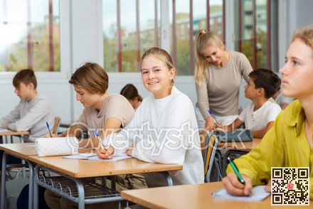 Group of school kids and teacher during lesson