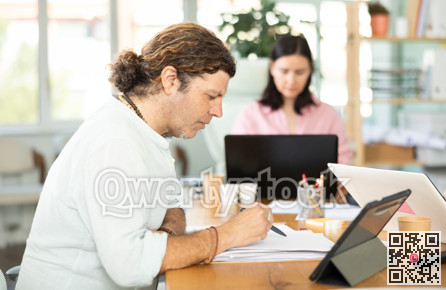 Working in modern office - businessman working on laptop