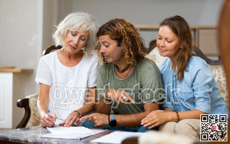 Elderly woman at table in home room filling up documents with family