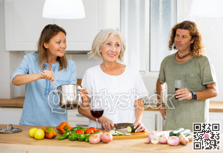 Portrait of mature housewife preparing family dinner at kitchen table