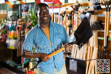 Portrait of an african american man choosing working tools