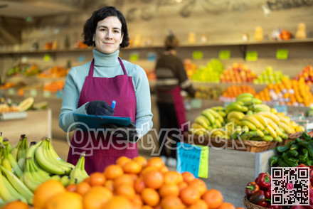 Woman store employee with folder of documents takes inventory in vegetable store