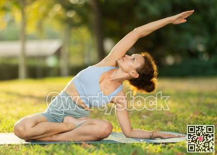 Adult woman doing yoga in lotus position