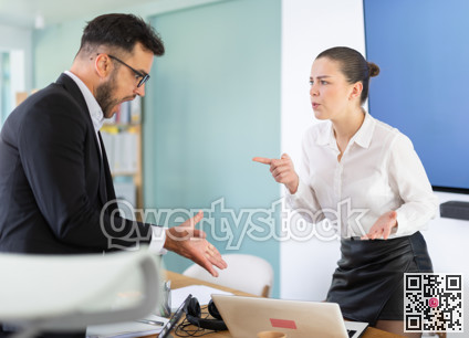 Man and woman arguing in the middle of the office