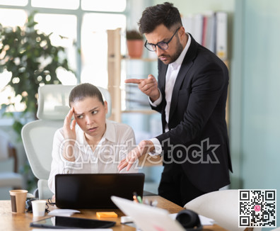 man, the head of a successful company, chastises an employee from the IT