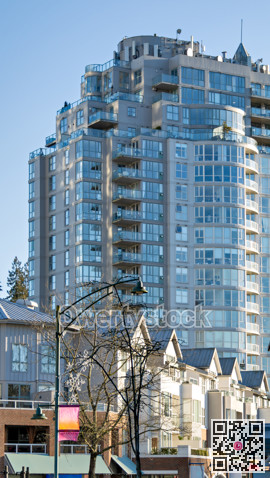 Residential high-rise and low-rise buildings on blue sky background