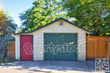 Old garage and entrance door from backstreet side of residential house