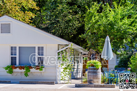 White resort house on bright sunny day in Okanagan valley