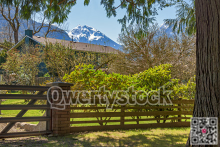 Gated residential area of a small town in Canada with snow top mountain view