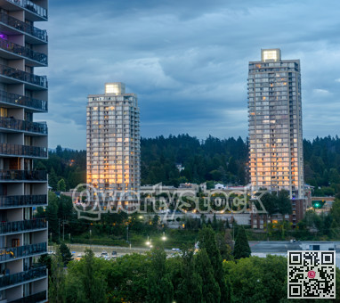 Sunset reflection in windows of high-rise buildings at Lougheed City Center