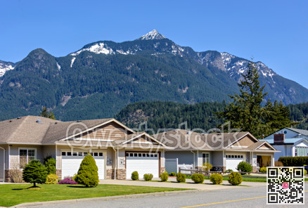Street of residential duplex house on beautiful nature background in British Columbia