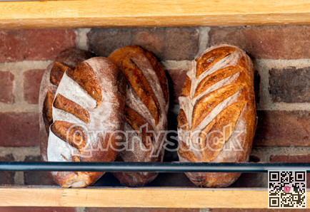 Baked loafs at the show shelf of a bakery