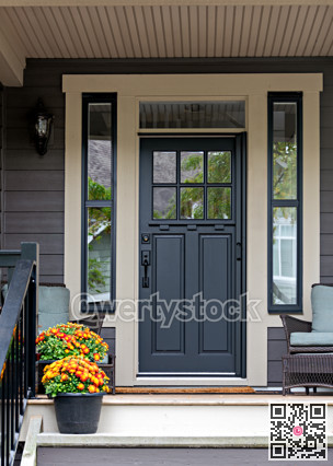 Porch and entrance of a nice residential house with two flower pots